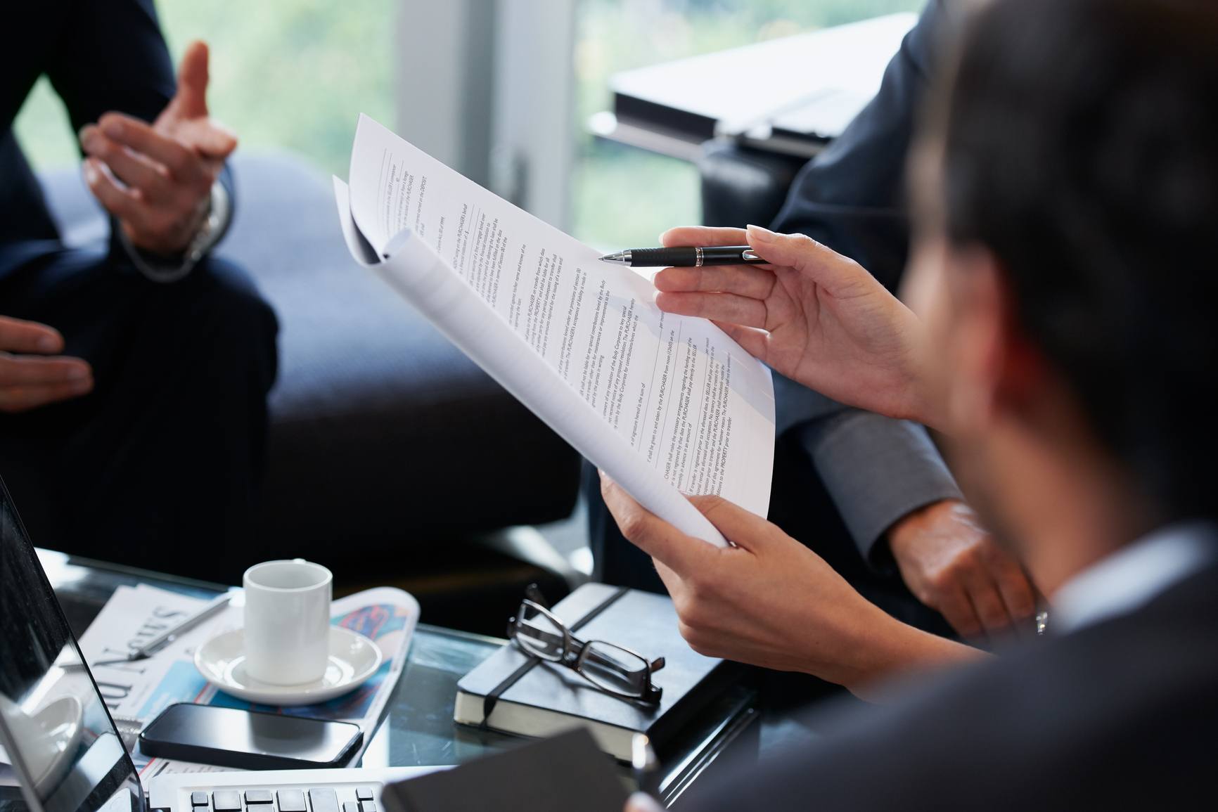 Hands holding documents