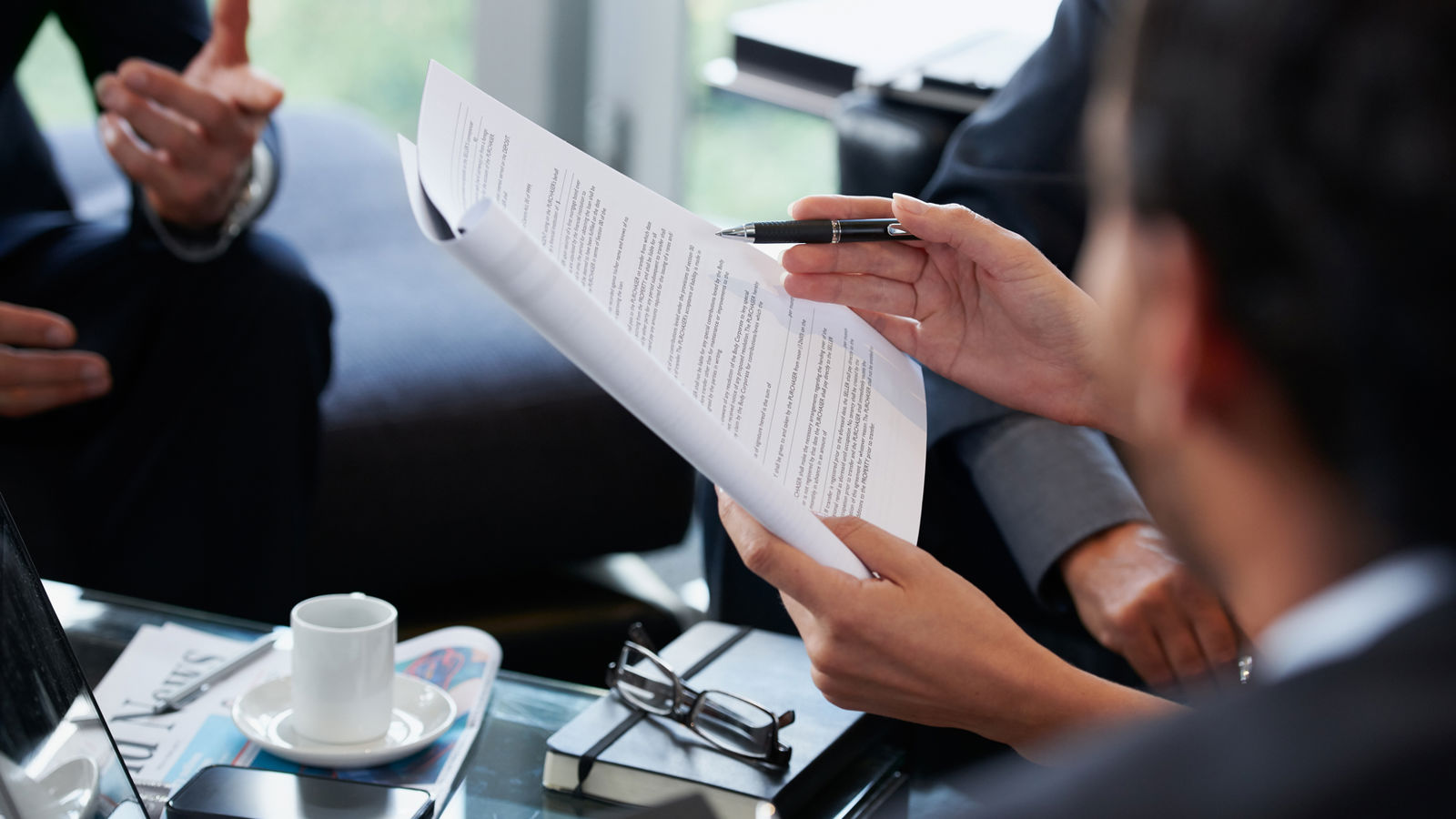 Hands holding documents